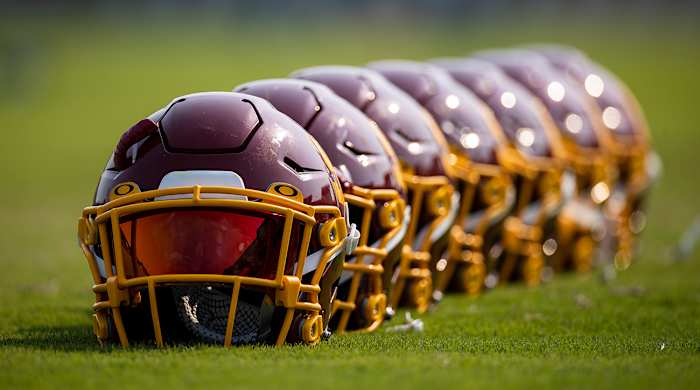Row of Washington Football Team helmets.
